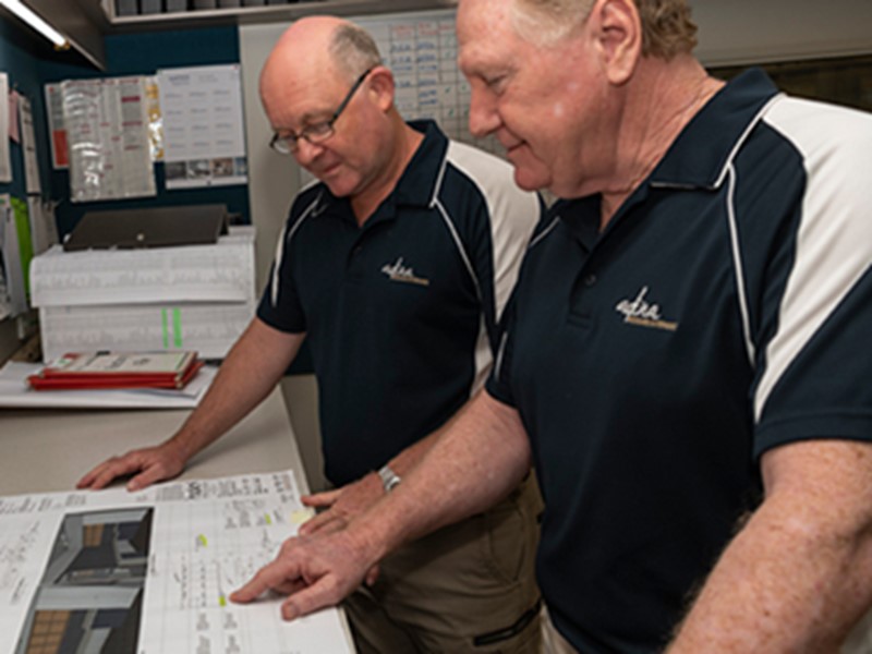 Adina team members looking at a job