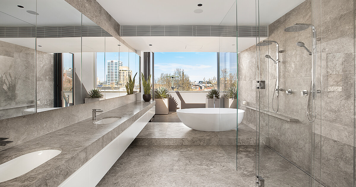 Long modern bathroom with large bath and shower spaces