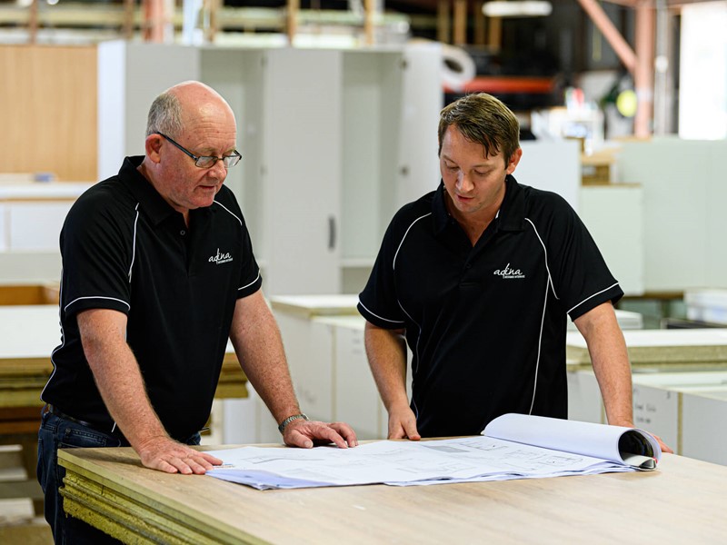Adina team members looking at a job
