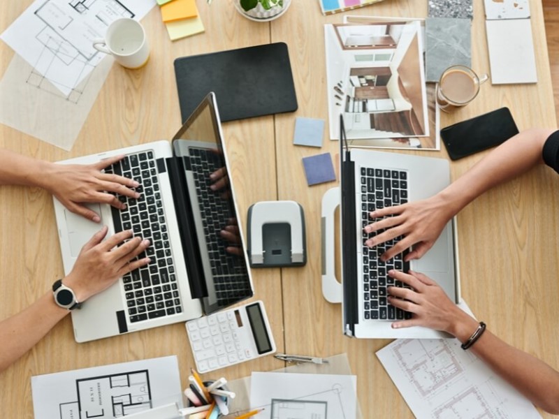 Interior designers working at a desk