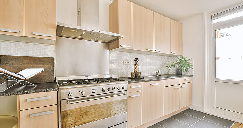 Kitchen with light neutral colour cabinets