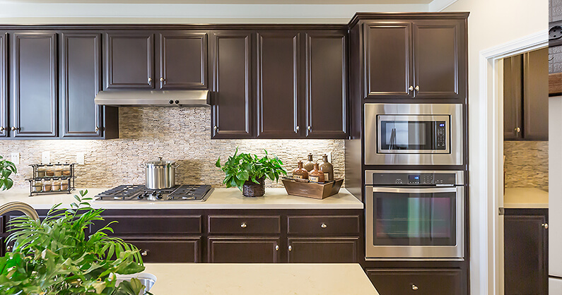 Kitchen with dark wood cabinets