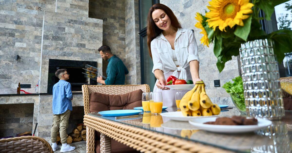 Family making breakfast in their outdoor kitchen