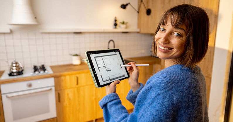 Kitchen designer holding an ipad