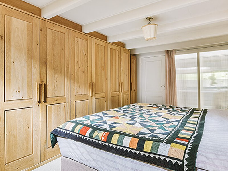 Bedroom with custom storage cabinets