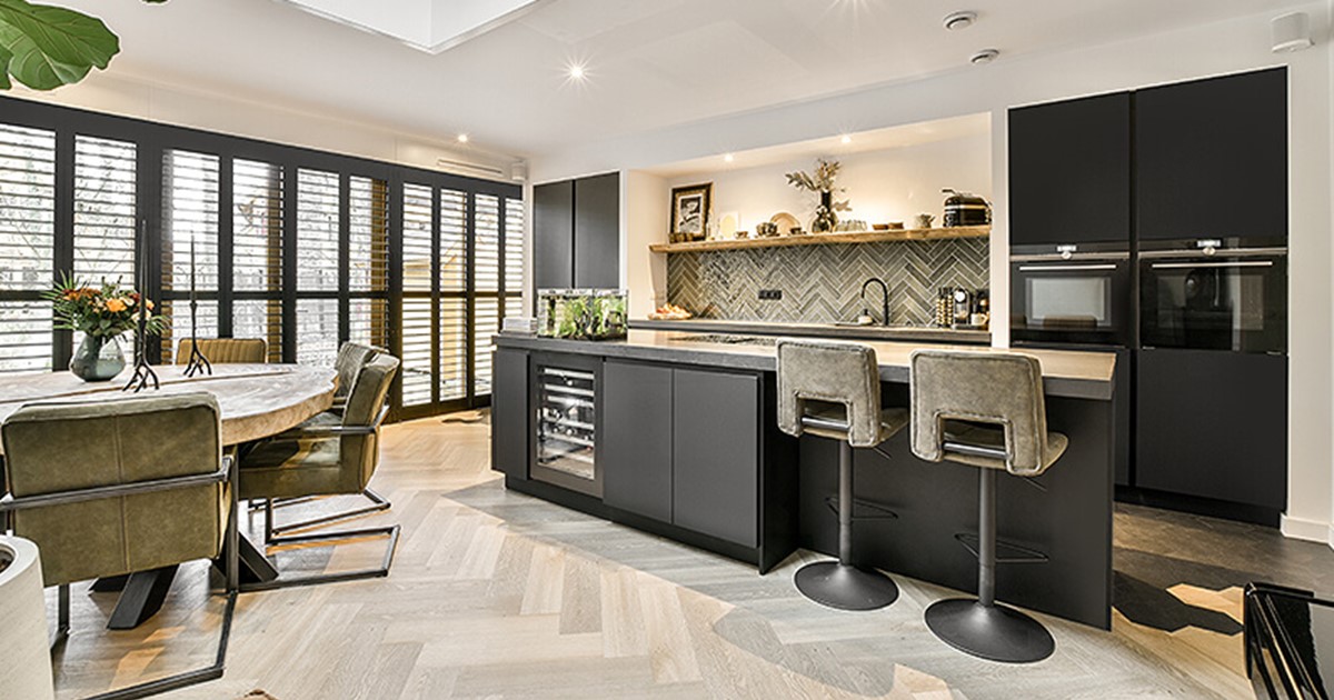 Open plan kitchen with eating and cooking zones