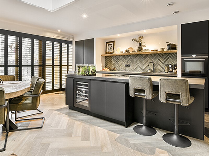 Open plan kitchen with eating and cooking zones