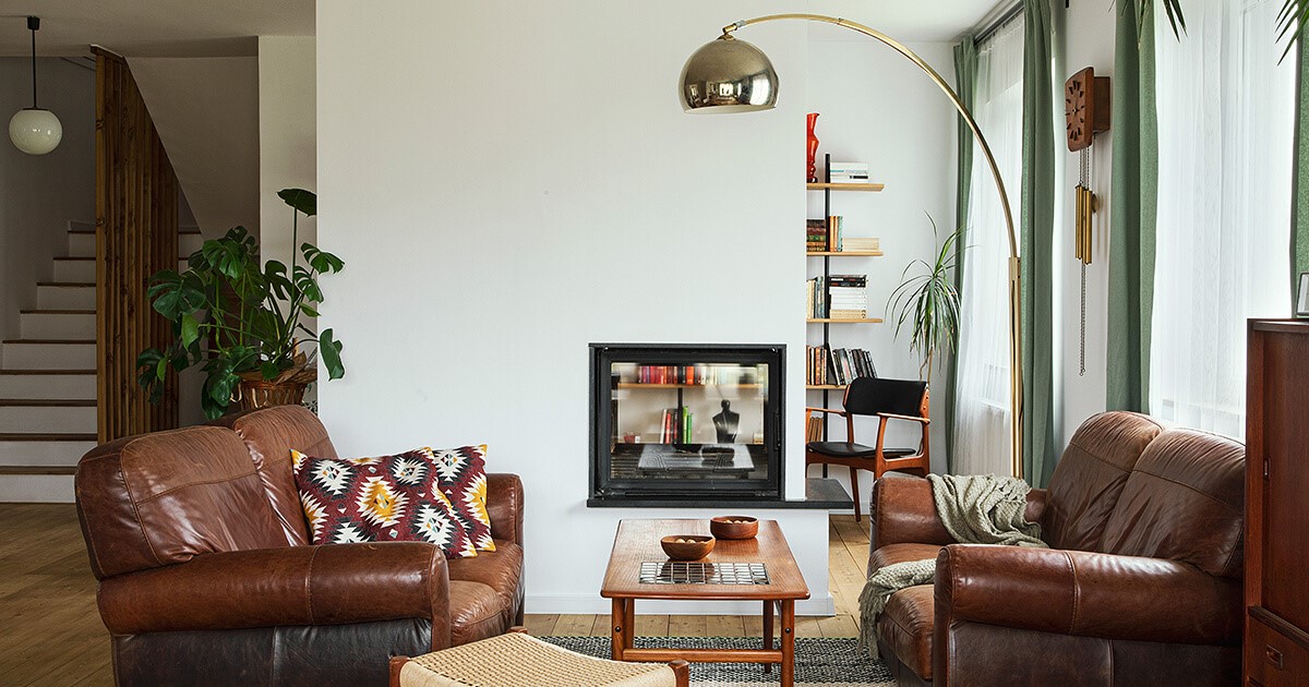 Small lounge room with lamp and brown furniture