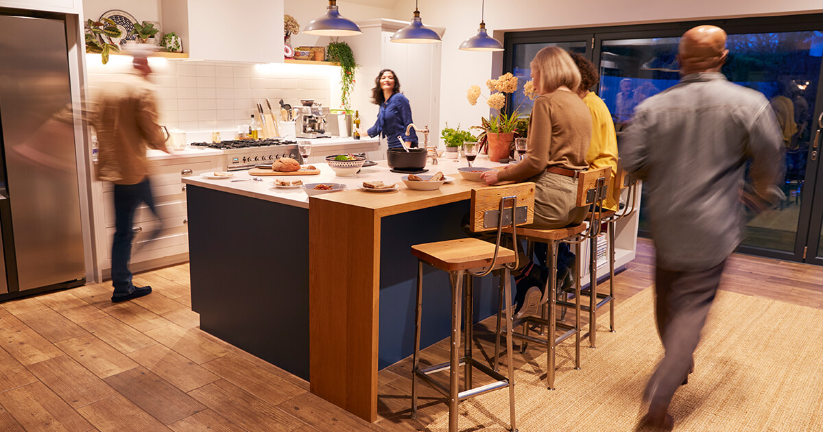 Happy couple sitting on kitchen floor