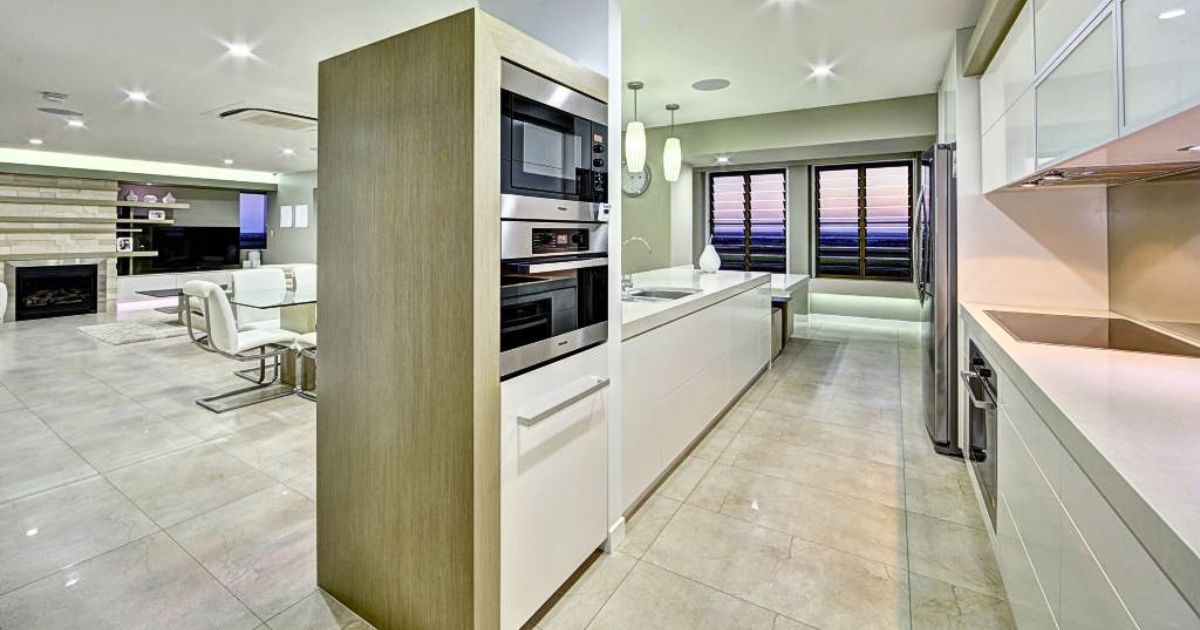 Kitchen with hidden appliances using cabinetry