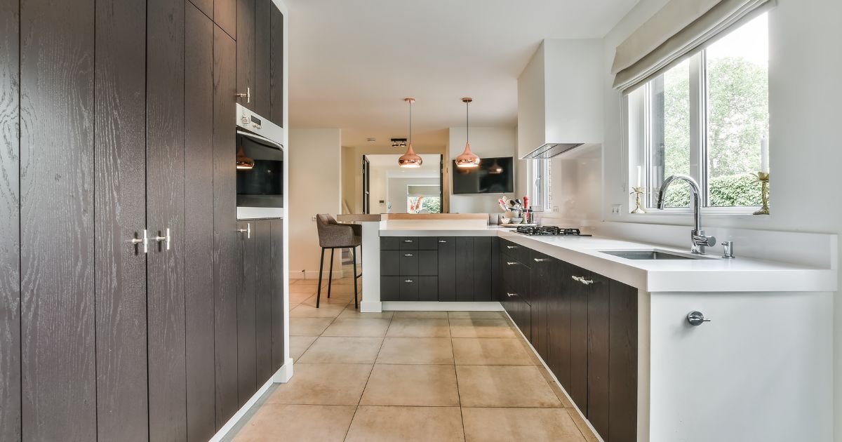 Galley kitchen with seating at end