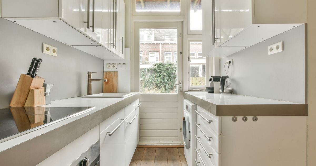 Galley kitchen with window at the end