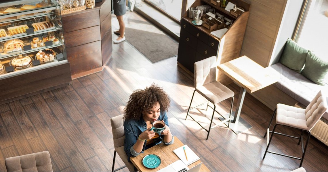 Woman drinking coffee at cafe